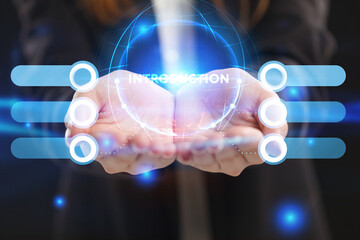 Business, Technology, Internet and network concept. Young businessman working on a virtual screen of the future and sees the inscription: Introduction