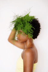 Black woman with the green plant