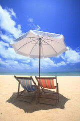 beach chairs and umbrella on the beach