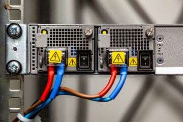 Electrical connection of equipment to the cabinet. wires positive and negative red and blue. Horizontal orientation.