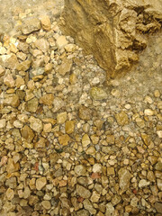 river stones under the water