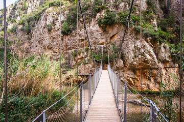 Footbridge, rope suspension bridge over the river Turia, Puentes Colgantes, Charco Azul, Chulilla, Spain