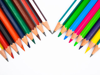 Two different row of different colored wood pencil crayons with one beside another