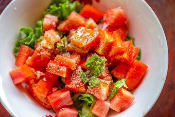 Vegetable green salad with tomatoes and Fresh Lettuce. Green salad close-up.