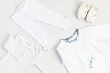 Cute newborn clothes. Organic cotton baby apparel mockup. Flat lay, top view