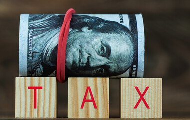 dollars marked GNA tax in wooden cubes