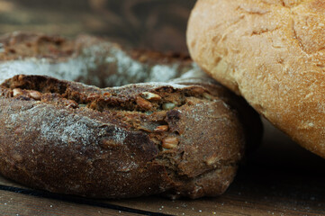 fresh country bread on a wooden background