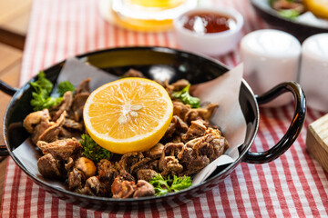 Tasty meat meal roulette with lemon close up