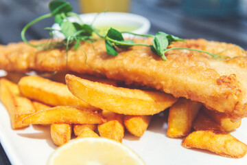 Traditional English Food such as Fish and Chips with green mushy peas served in the Pub or Restaurant