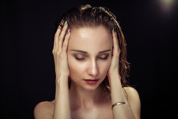 Fototapeta premium Beautiful woman on black background in studio
