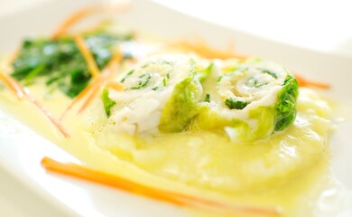 Fine dining food and drink being prepared and displayed in classic white crockery in a kitchen environment,