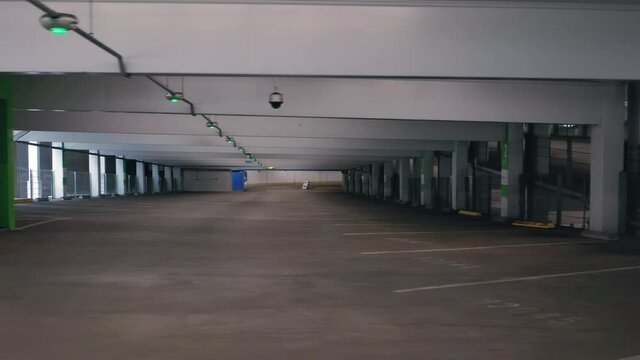 A pandemic outbreak in California with empty parking garage building. Industrial interior. Empty parking building during Coronavirus Covid-19 outbreak quarantine. 4K shutdown footage, California, USA