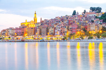 Naklejka premium Menton mediaeval town on the French Riviera in the Mediterranean during sunset, France. 