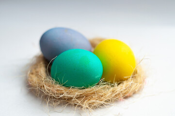 colourful easter eggs in a nest