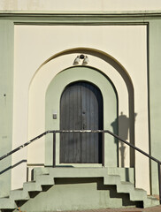 Fototapeta premium Architectural detail of a side door to the chappel in downtown Rincon, Puerto Rico 