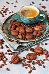 Cup of coffee and cookies on the  gray table