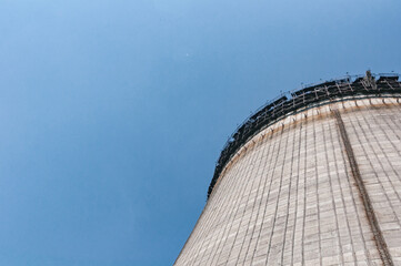 Fototapeta premium Cooling stack of Reactors building in Pripyat, Chernobyl exclusion Zone. Chernobyl Nuclear Power Plant Zone of Alienation in Ukraine