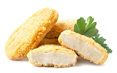 Frozen cutlets whole and half on a white plate. Isolated