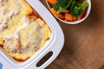 Parmegiana Steak also known as Filet Parmegiana. .Accompanied by vegetable salad