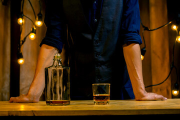 An elegant man suffering from alcoholism drinking whisky