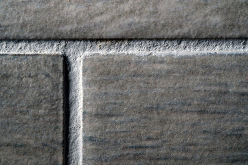 stone ceramic glued tiles seams close-up macro texture background