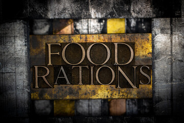 Food Rations text formed with real authentic typeset letters on vintage textured silver grunge copper and gold background