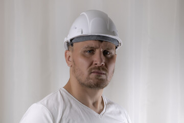 A man in a white helmet on a white background.