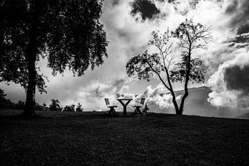 bench and clouds one