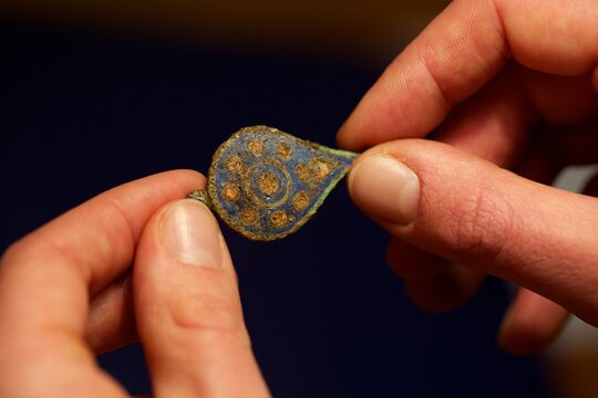 Archaeology Artefact Being Examined By An Archaeology Student,