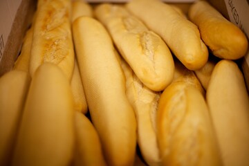 Up close of a collection of French baguettes,