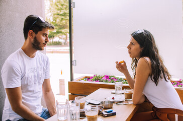 Portrait of a very fashionable young couple having fun in the city