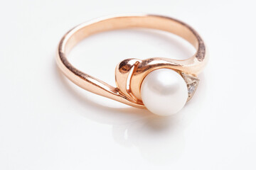 Golden ring with pearl, macro