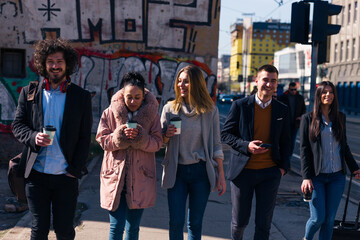 Group of friends (colleagues) hanging out in an urban area.