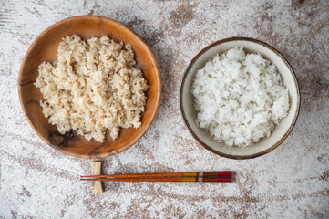 white and brown japanese rice in bowls