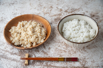 white and brown japanese rice in bowls