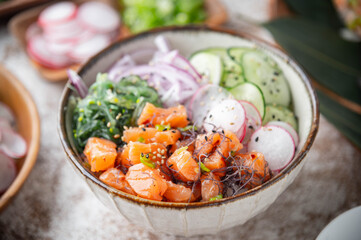 colorful salmon poke bowl with vegetables