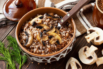 Crumbly buckwheat  porridge with  mushrooms, food healthy