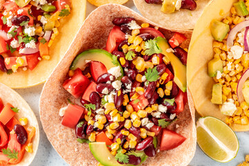 Vegetarian Mexican food, a flat lay. Tacos with vegetables, overhead close-up shot