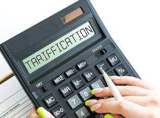 A calculator with text Tarification on the display