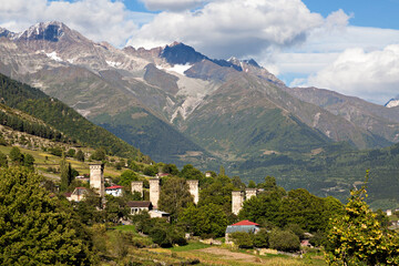 Fototapeta na wymiar Village houses with medieval towers in the Caucasus Mountains, Georgia