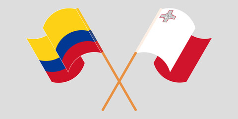 Crossed and waving flags of Malta and Colombia