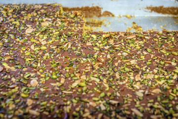 Close up on a plate with type of Arabic sweets Baklava with pistachio nuts in sweet shop in Lebanon