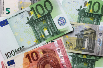Close-up of euro banknotes on a white background. Currency, financial. Money concept. Flat lay, layout, top view. Economy, inflation