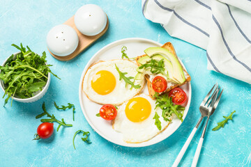 Healthy breakfast with egg, toast and salad.