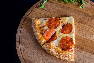 A slice of pepperoni Pizza