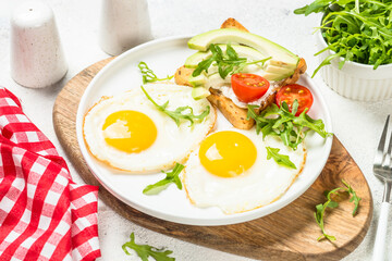 Healthy breakfast with egg, toast and salad.