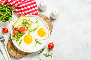 Healthy breakfast with egg, toast and salad.