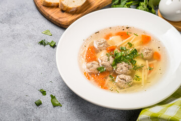 Meatballs soup with vegetables top view.
