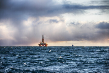Offshore oil rig at sunset time