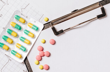 Pills on the table at the doctor. Medicine, treatment, illness. Medication in tablets.